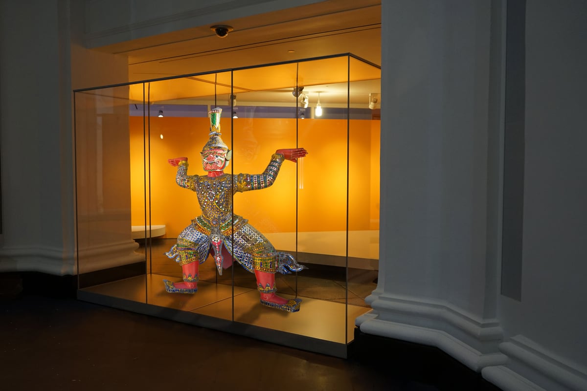 Statue inside a long acrylic exhibit case