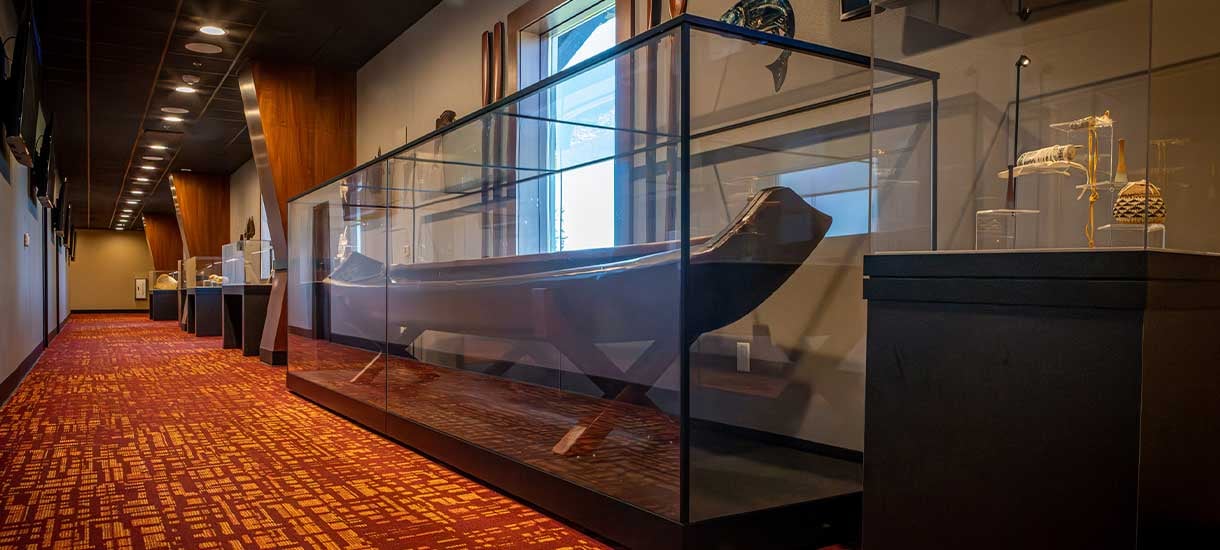 Long case with a canoe on a stand inside